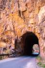 USA, New Mexico, Jemez National Recreation Area. Gilman tunnels cut through cliff. Art Print